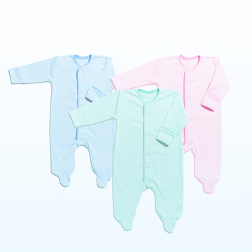 Three baby onesies in blue, green, and pink on a white background